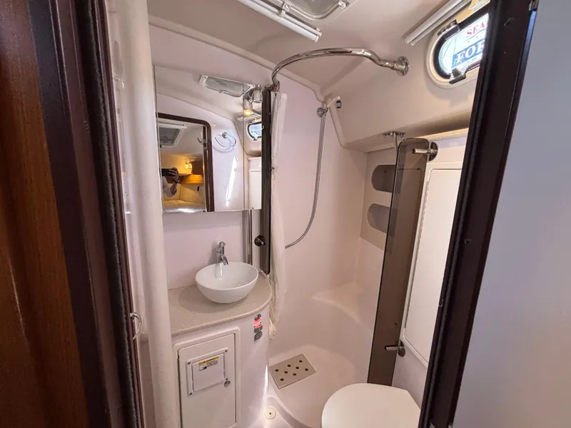Slide: The Image of Compact bathroom in a 2019 Catalina 385 yacht with shower, sink, and mirror. - 31