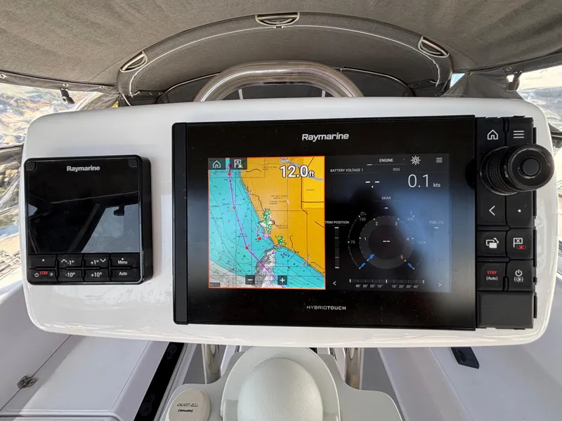 Slide: The Image of Raymarine navigation system on 2019 Catalina 385 sailboat, displaying nautical charts and controls. - 4