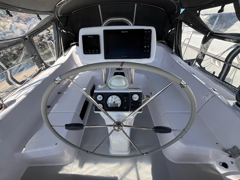 Slide: The Image of Cockpit of 2019 Catalina 385 sailboat with steering wheel and navigation instruments. - 5