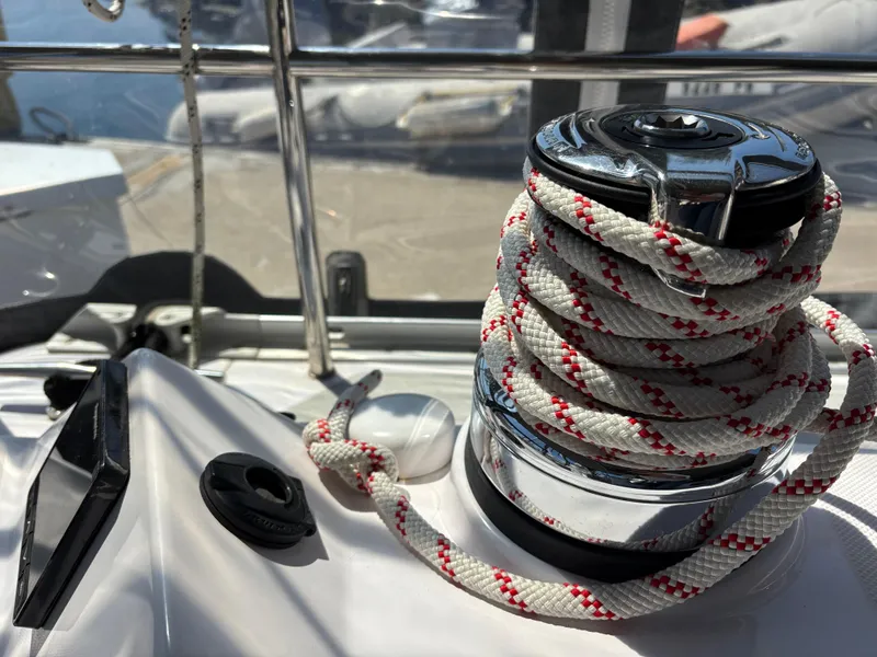 Slide: The Image of Winch with rope on 2019 Catalina 385 sailboat deck, docked in marina. - 9