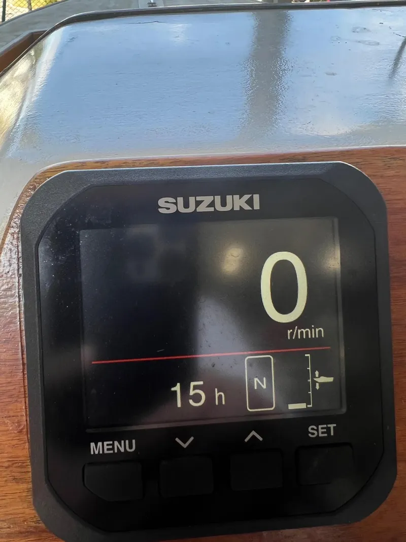 Slide: The Image of Suzuki engine display on a 1999 Northern Bay Center Console boat. - 6