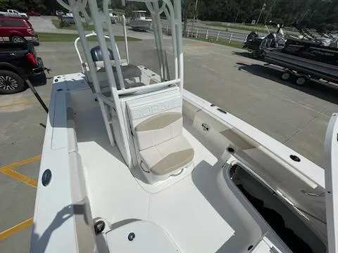 Slide: The Image of 2016 Robalo 246 Cayman boat interior with seating and storage compartments. - 13