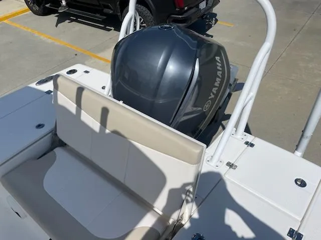 Slide: The Image of 2016 Robalo 246 Cayman boat with Yamaha outboard motor in parking lot. - 9
