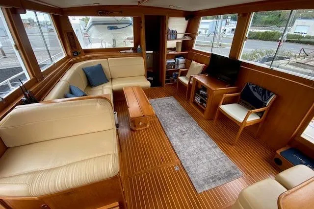 Slide: The Image of Luxurious interior of a 2002 Grand Banks 46 Classic yacht with elegant wood finishes. - 14
