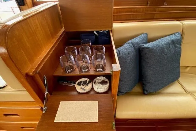 Slide: The Image of Interior of 2002 Grand Banks 46 Classic yacht with glassware and cushions. - 16