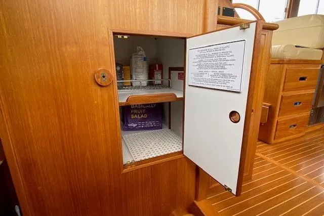 Slide: The Image of Wooden cabinet interior on a 2002 Grand Banks 46 Classic yacht. - 23