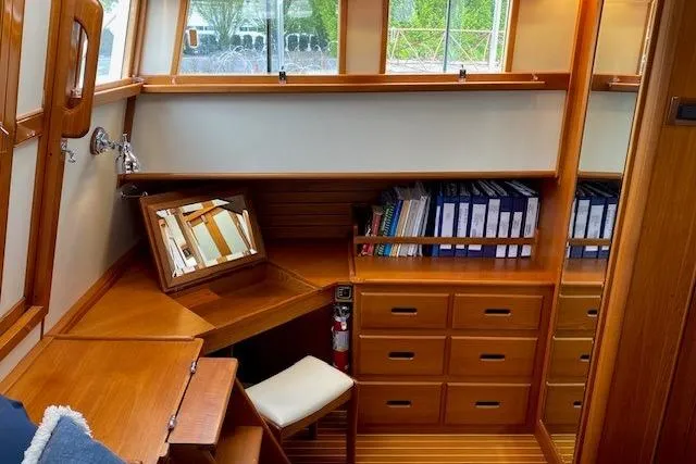 Slide: The Image of Luxurious wooden interior of 2002 Grand Banks 46 Classic yacht with desk and storage. - 25