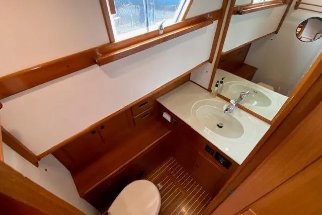 Slide: The Image of Bathroom interior of 2002 Grand Banks 46 Classic yacht with wooden accents and modern fixtures. - 29