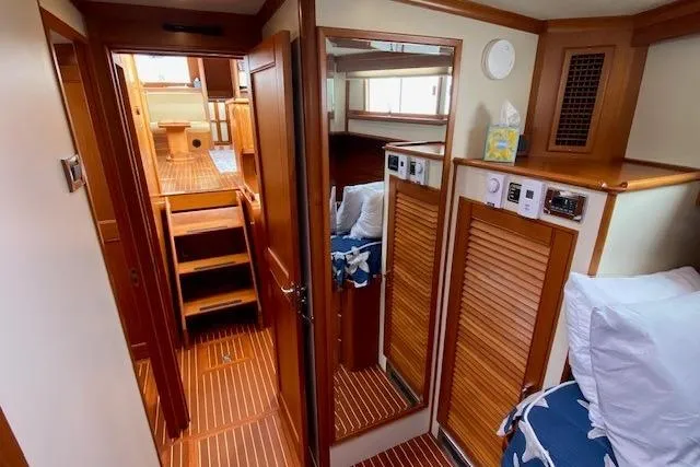 Slide: The Image of Interior of 2002 Grand Banks 46 Classic yacht with wooden finishes and cozy cabin. - 34