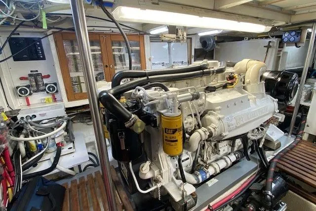 Slide: The Image of Engine room of 2002 Grand Banks 46 Classic yacht, featuring a well-maintained engine. - 41