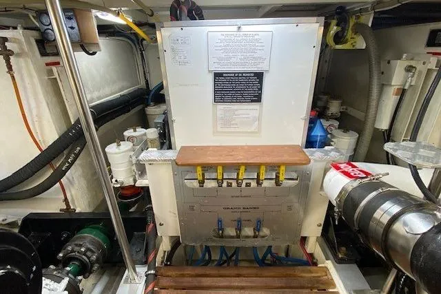Slide: The Image of Engine room of 2002 Grand Banks 46 Classic yacht, showcasing mechanical components and systems. - 43
