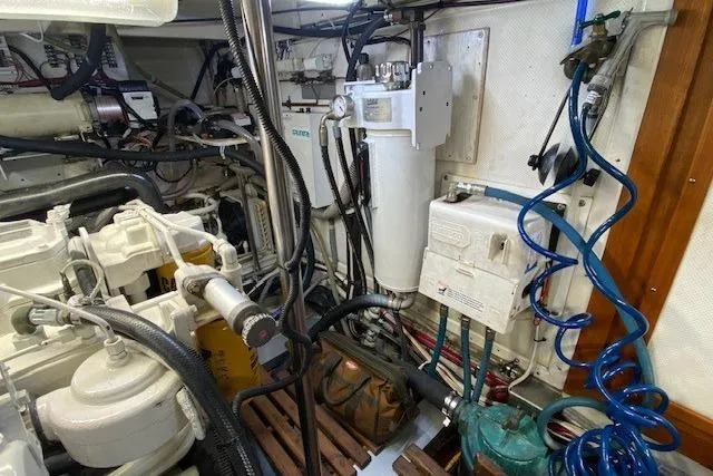 Slide: The Image of Engine room of 2002 Grand Banks 46 Classic yacht, showcasing mechanical components and wiring. - 45