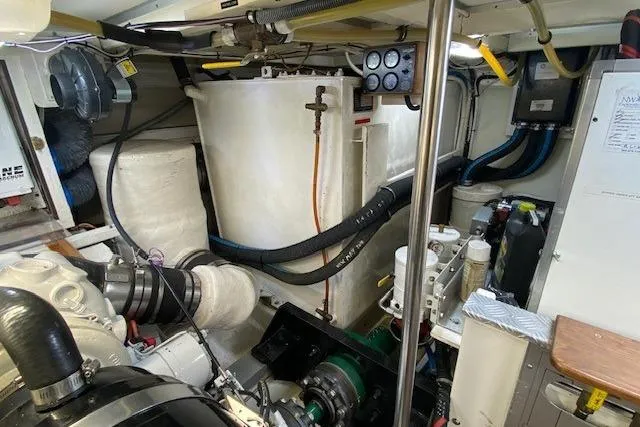 Slide: The Image of Engine room of 2002 Grand Banks 46 Classic yacht, showcasing machinery and equipment. - 47