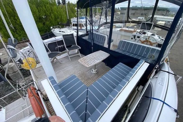 Slide: The Image of 2002 Grand Banks 46 Classic yacht with spacious deck seating and helm station. - 5