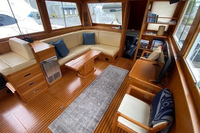 Slide: The Image of Luxurious interior of 2002 Grand Banks 46 Classic yacht with elegant seating and wooden finishes. - 9
