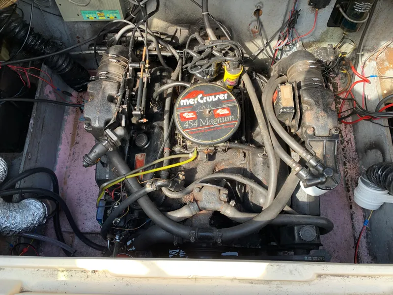 Slide: The Image of 1987 Sea Ray 268 Sundancer engine compartment with MerCruiser 454 Magnum engine. - 12