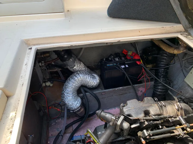 Slide: The Image of Engine compartment of a 1987 Sea Ray 268 Sundancer boat. - 13