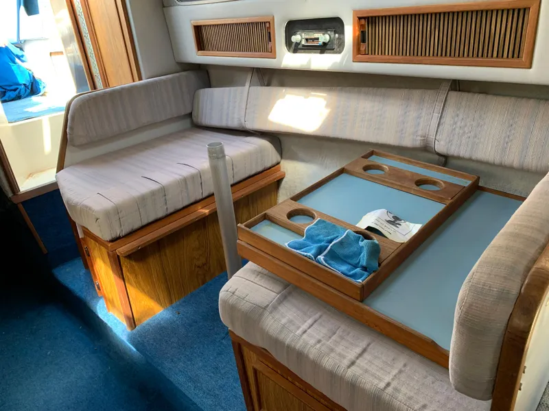 Slide: The Image of Interior of 1987 Sea Ray 268 Sundancer with seating and table. - 3