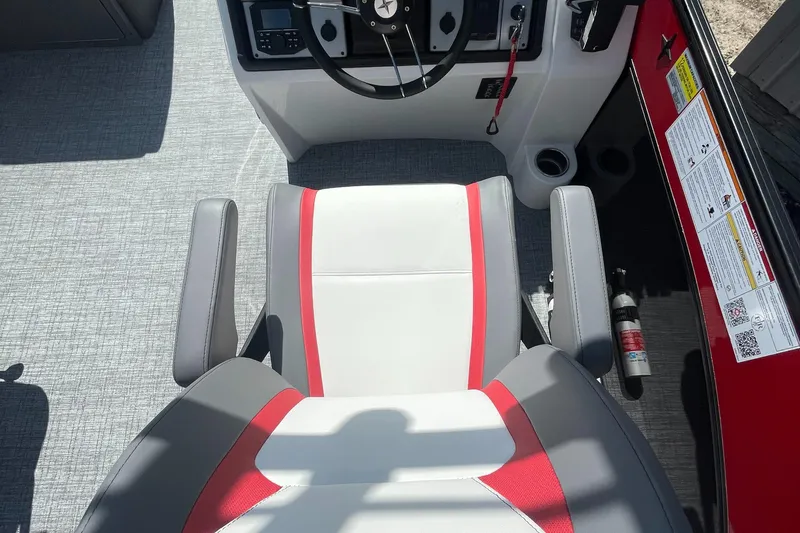 Slide: The Image of 2023 Berkshire 23 RFX STS boat captain's chair and helm station. - 10