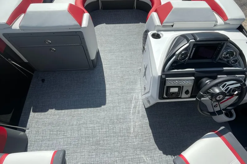 Slide: The Image of 2023 Berkshire 23 RFX STS boat interior with modern dashboard and seating. - 11