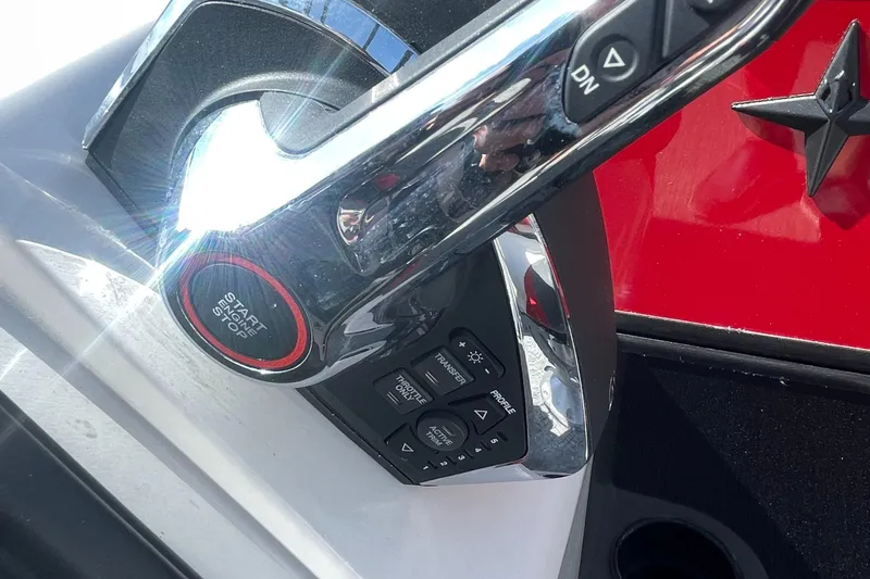 Slide: The Image of Close-up of 2023 Berkshire 23 RFX STS boat control panel with start/stop button. - 14