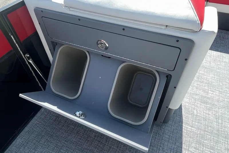 Slide: The Image of 2023 Berkshire 23 RFX STS boat storage compartment with dual bins. - 16