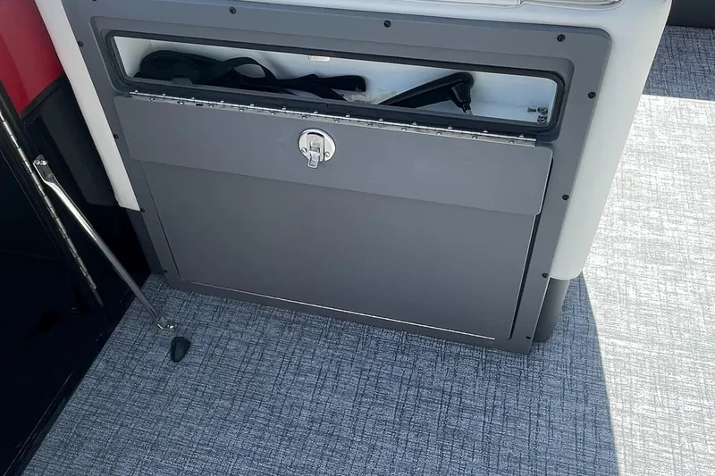 Slide: The Image of 2023 Berkshire 23 RFX STS storage compartment on boat deck. - 17