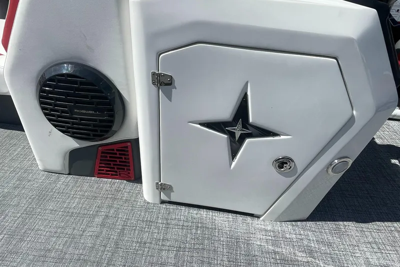 Slide: The Image of 2023 Berkshire 23 RFX STS boat interior with speaker and storage compartment. - 18