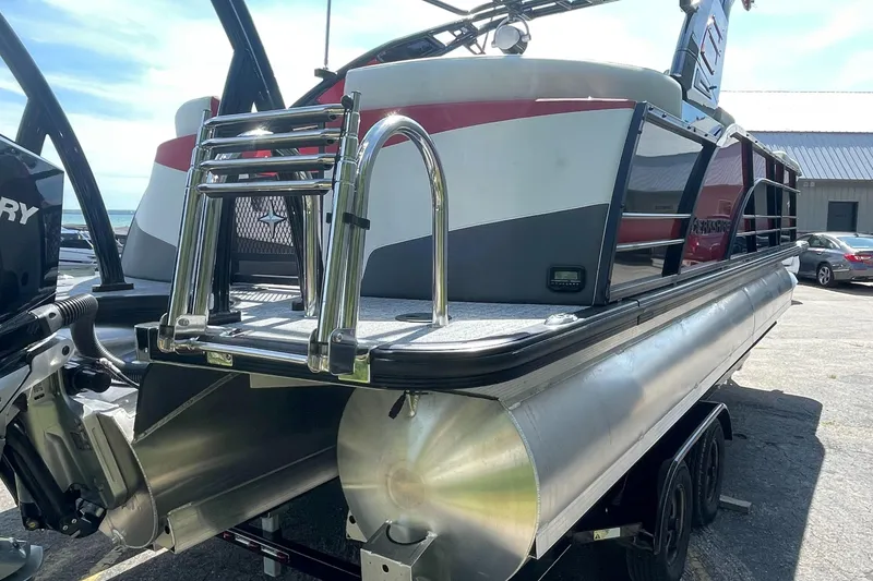 Slide: The Image of 2023 Berkshire 23 RFX STS pontoon boat with rear ladder and Mercury outboard motor. - 3