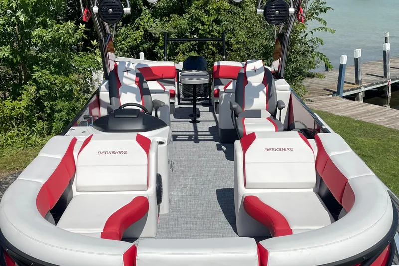 Slide: The Image of 2023 Berkshire 23 RFX STS pontoon boat with red and white seating. - 4