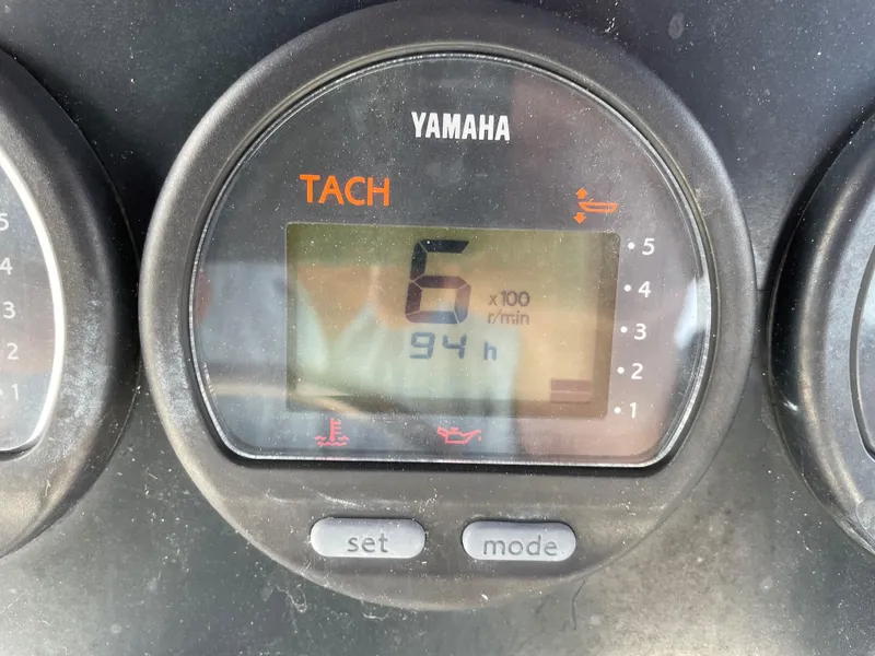 Slide: The Image of Yamaha tachometer on 1999 Boston Whaler Outrage 23 showing 94 hours. - 12