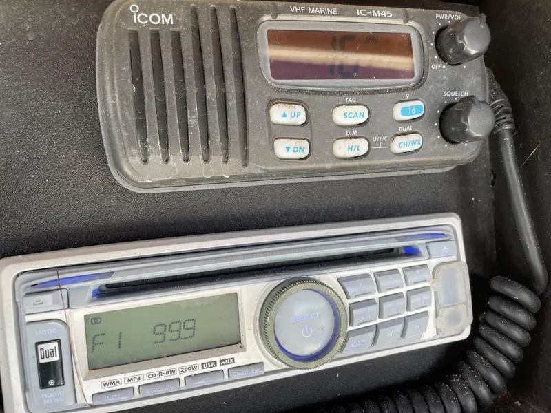 Slide: The Image of VHF marine radio and stereo system on a 1999 Boston Whaler Outrage 23 boat. - 19