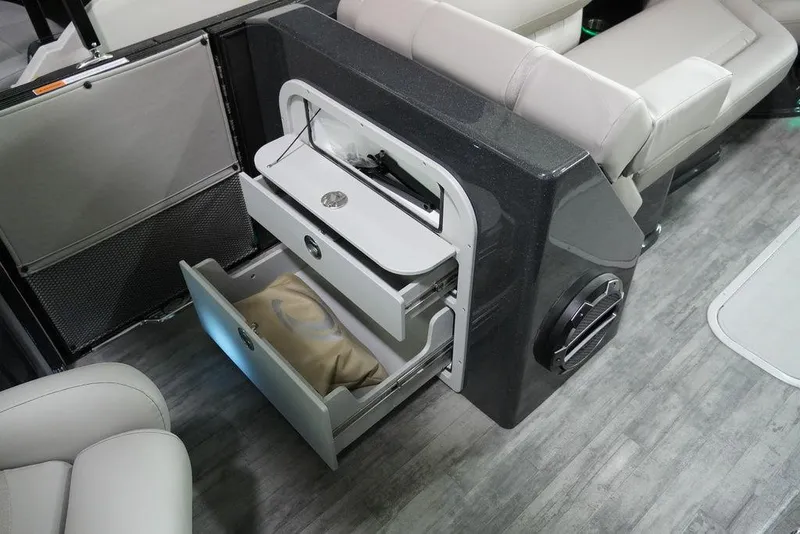 Slide: The Image of 2024 Crest Savannah 270 SLC CP3 interior storage drawers and seating area. - 10