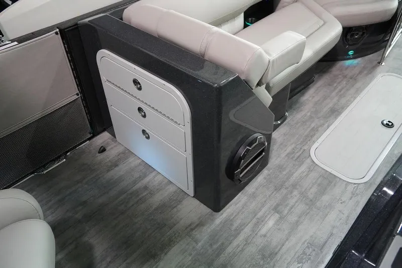 Slide: The Image of 2024 Crest Savannah 270 SLC CP3 boat interior with storage drawers and seating. - 9