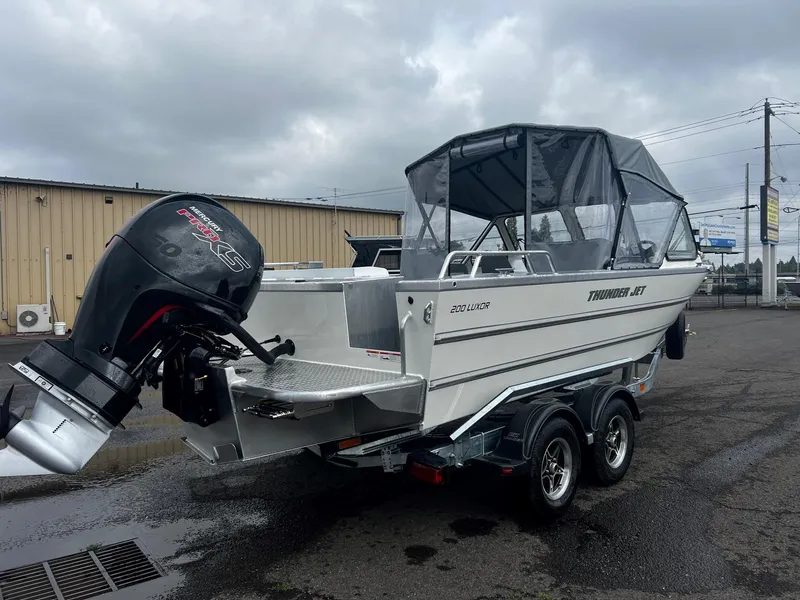 Slide: The Image of 2024 Thunder Jet 200 Luxor boat with outboard motor on a trailer. - 3