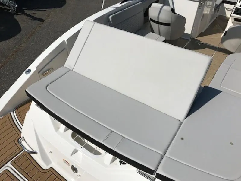 Slide: The Image of 2024 Sea Ray 230 SPX boat with sleek white seating and modern design. - 12