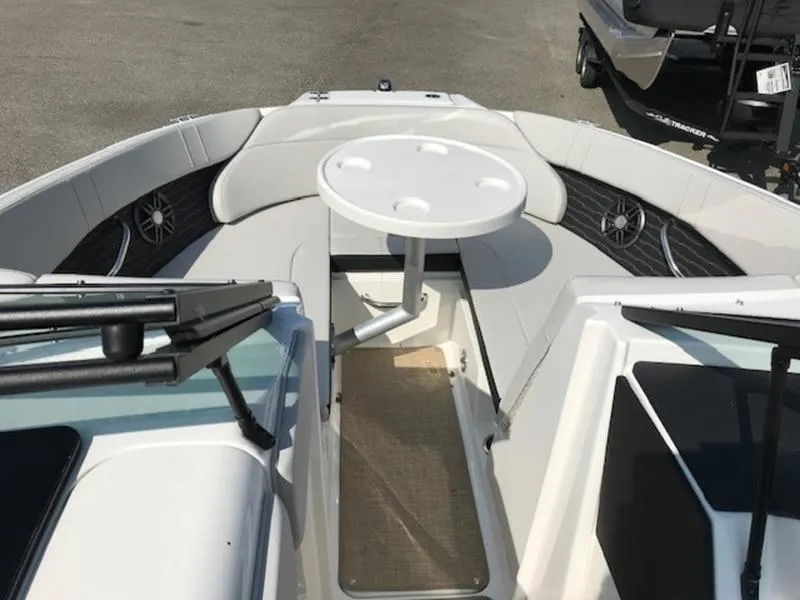 Slide: The Image of 2024 Sea Ray 230 SPX boat interior with seating and table. - 15