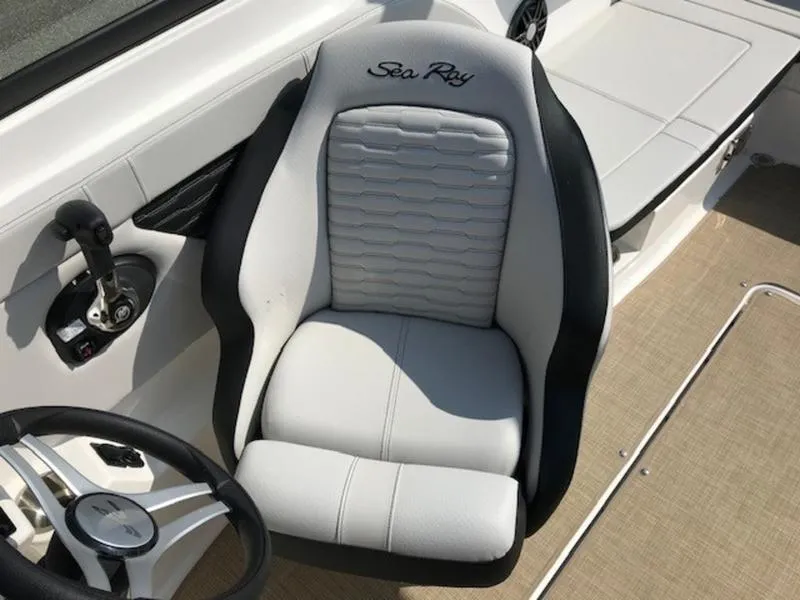 Slide: The Image of 2024 Sea Ray 230 SPX boat seat with steering wheel, showcasing luxury design. - 7