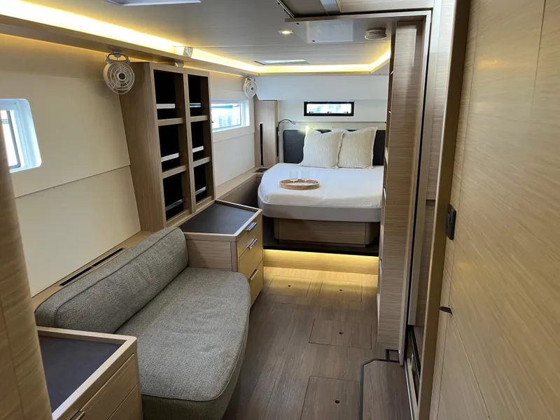 Slide: The Image of 2024 Lagoon 46 yacht bathroom with modern fixtures and skylight. - 15