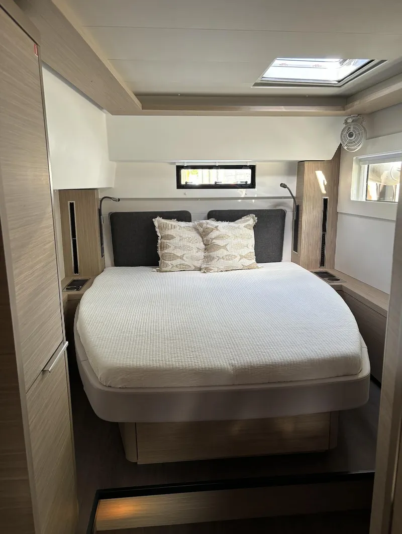 Slide: The Image of Modern bathroom in 2024 Lagoon 46 catamaran with sleek sink and storage. - 18