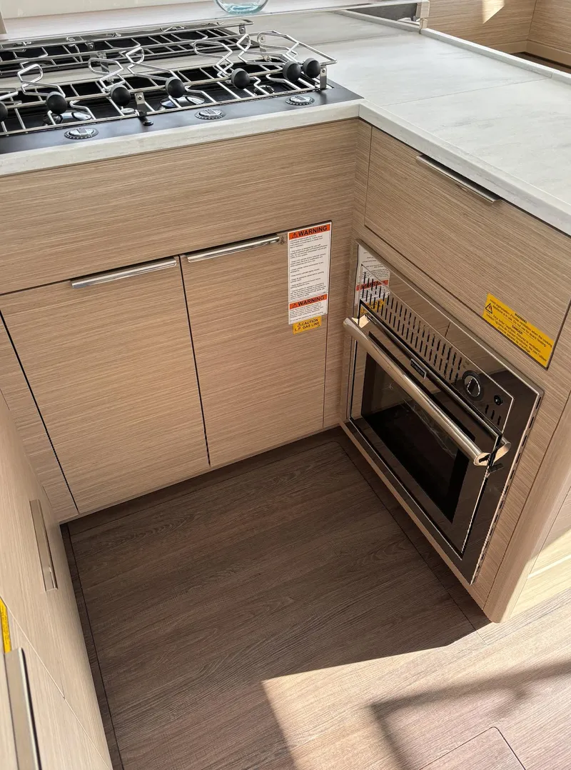 Slide: The Image of 2024 Lagoon 46 yacht bathroom with modern fixtures and sleek design. - 21