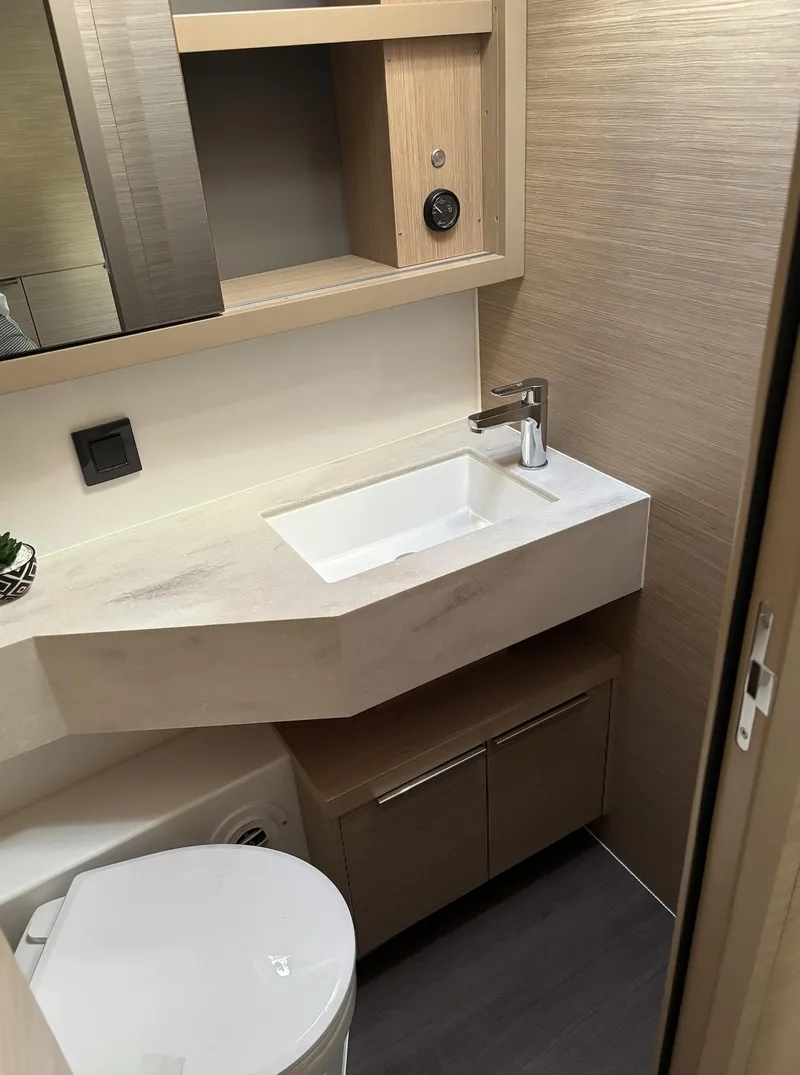 Slide: The Image of Modern kitchen interior of 2024 Lagoon 46 catamaran with large windows. - 25