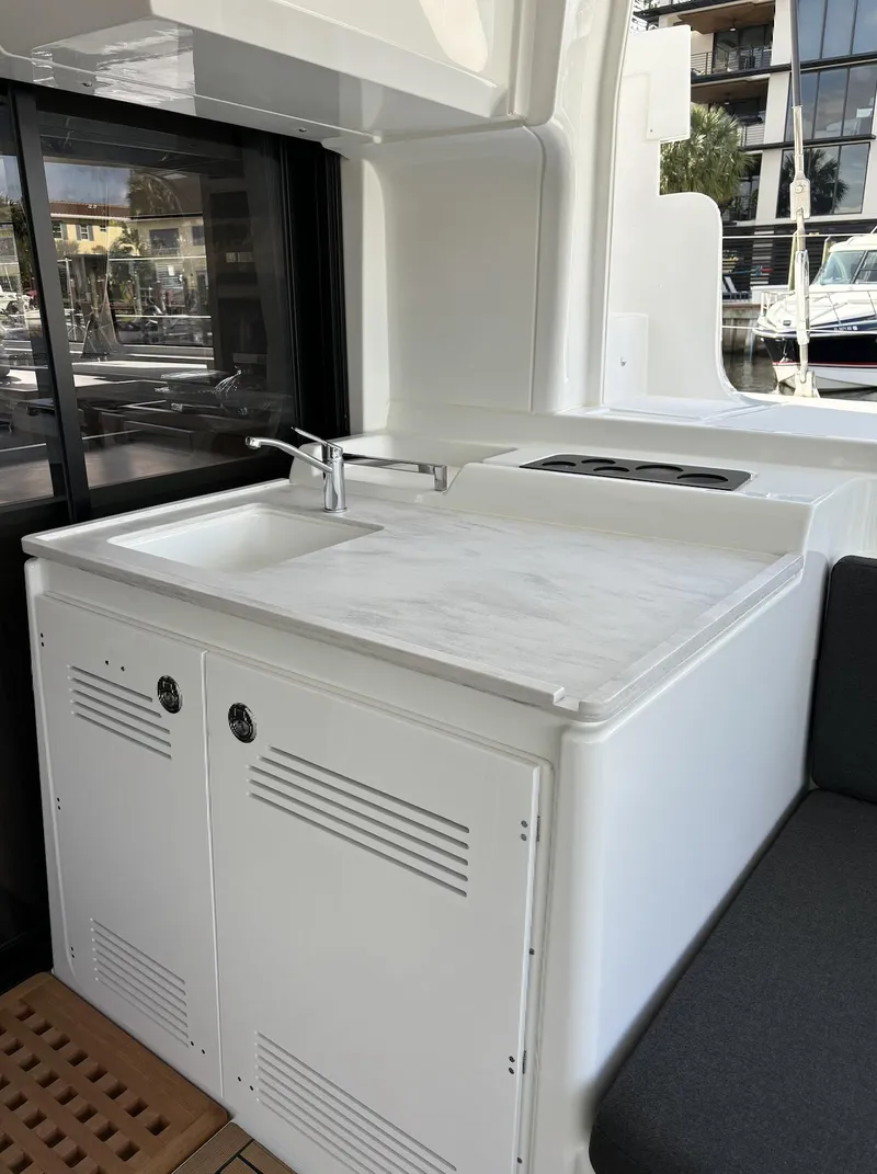 Slide: The Image of Luxurious interior of 2024 Lagoon 46 yacht with elegant decor and panoramic windows. - 35