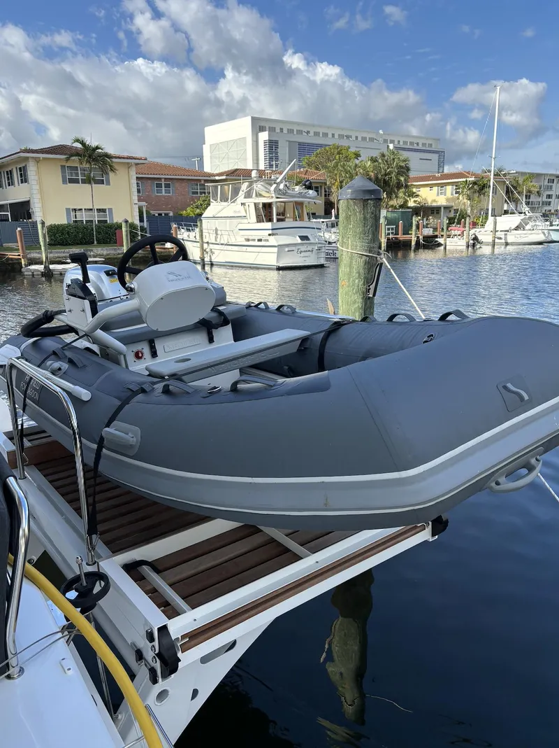 Slide: The Image of Interior view of 2024 Lagoon 46 yacht with modern kitchen and outdoor seating. - 37