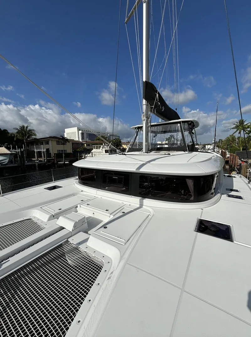 Slide: The Image of 2024 Lagoon 46 catamaran with spacious deck and modern design. - 4