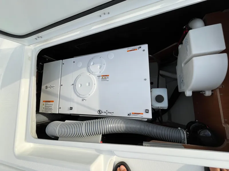 Slide: The Image of 2024 Lagoon 46 yacht interior with modern decor, TV, and storage shelves. - 40