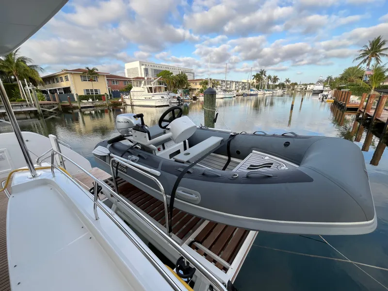 Slide: The Image of 2024 Lagoon 46 yacht helm station with navigation equipment and steering wheel. - 8