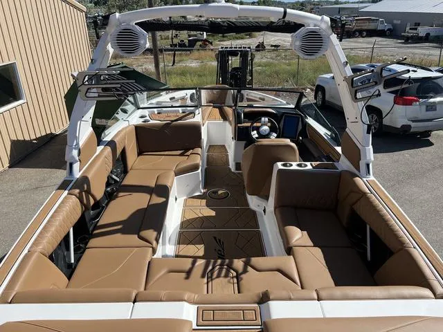 Slide: The Image of 2023 Tigé Z3 boat interior with tan leather seating and advanced dashboard. - 10