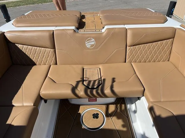 Slide: The Image of 2023 Tigé Z3 boat interior with tan leather seating and diamond stitching. - 12