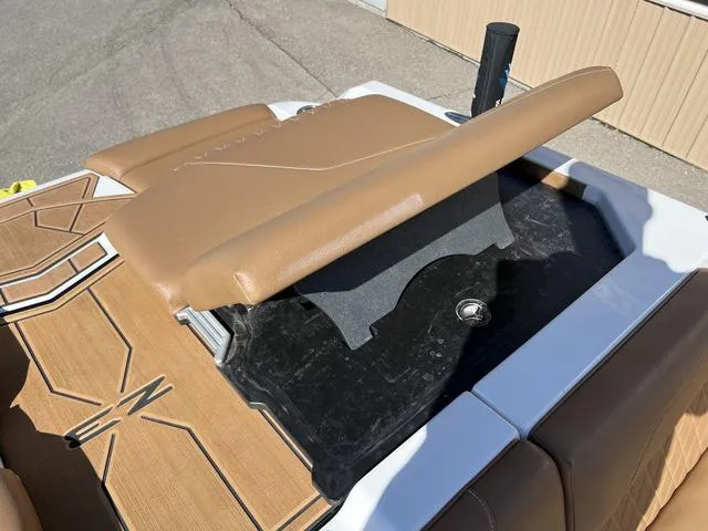 Slide: The Image of 2023 Tigé Z3 boat with tan upholstery and storage compartment. - 15